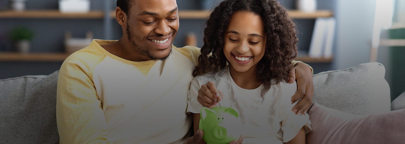 Father and Daughter with piggy bank